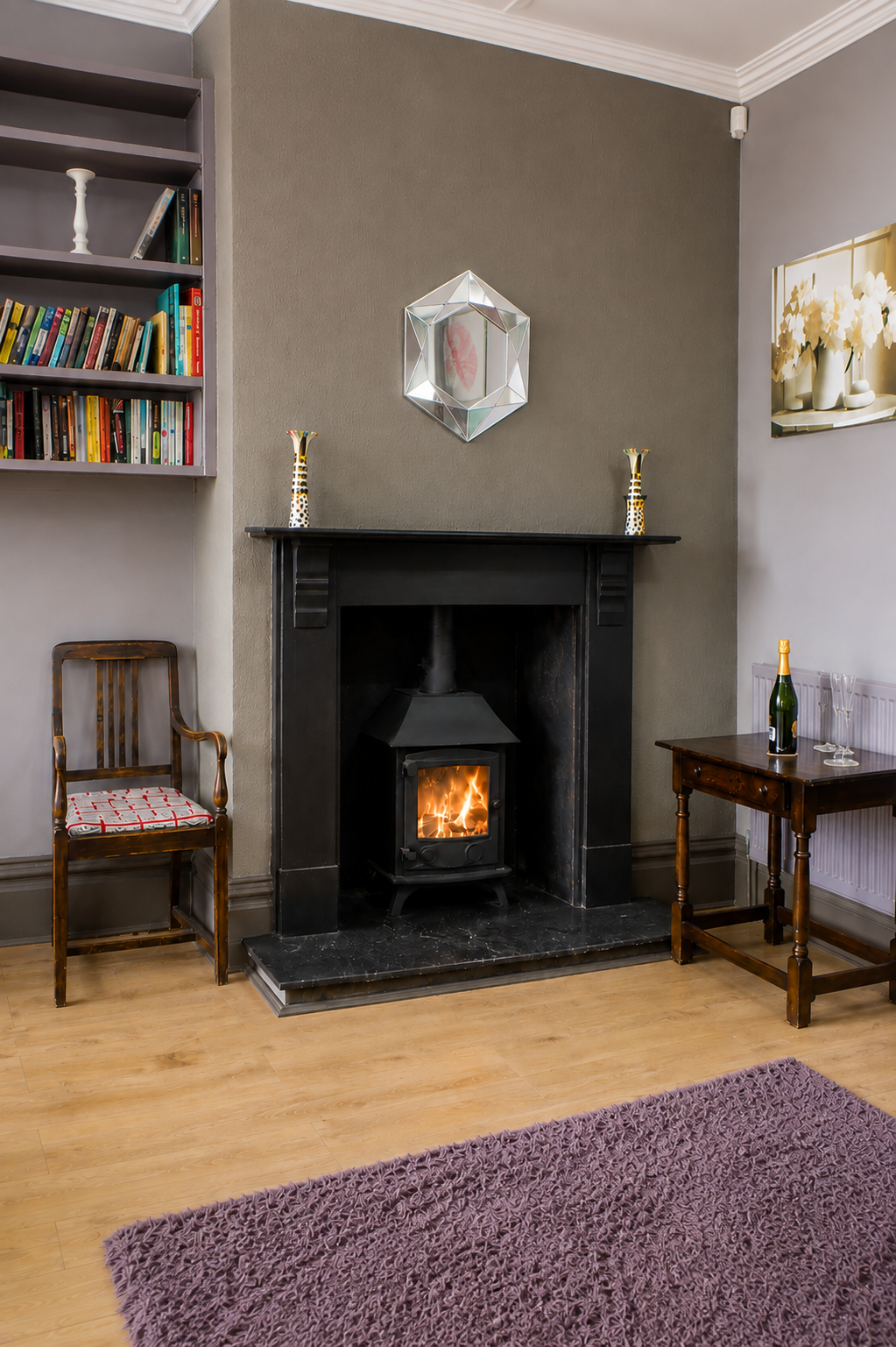 Cosy wood-burning stove and fireplace at Heather Brae