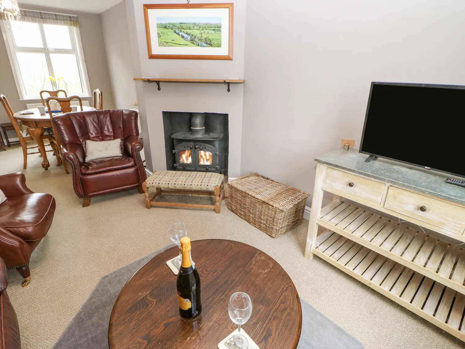 Additional sitting room with woodburner at Heather Brae