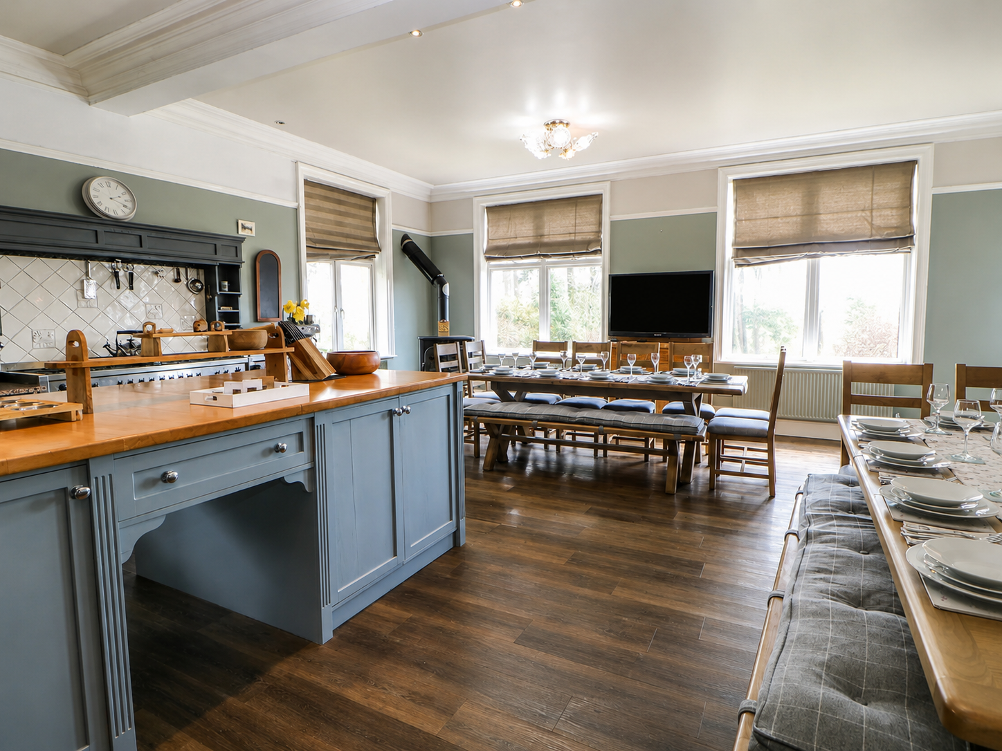 Open-plan kitchen and long dining table at Heather Brae