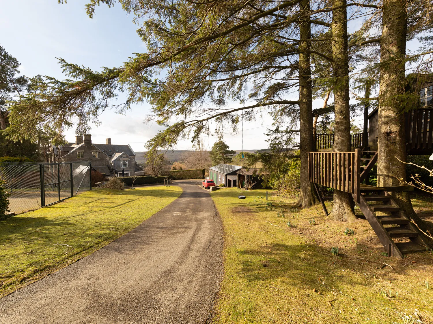 Driveway leading to the tree house and outdoor play area at Heather Brae
