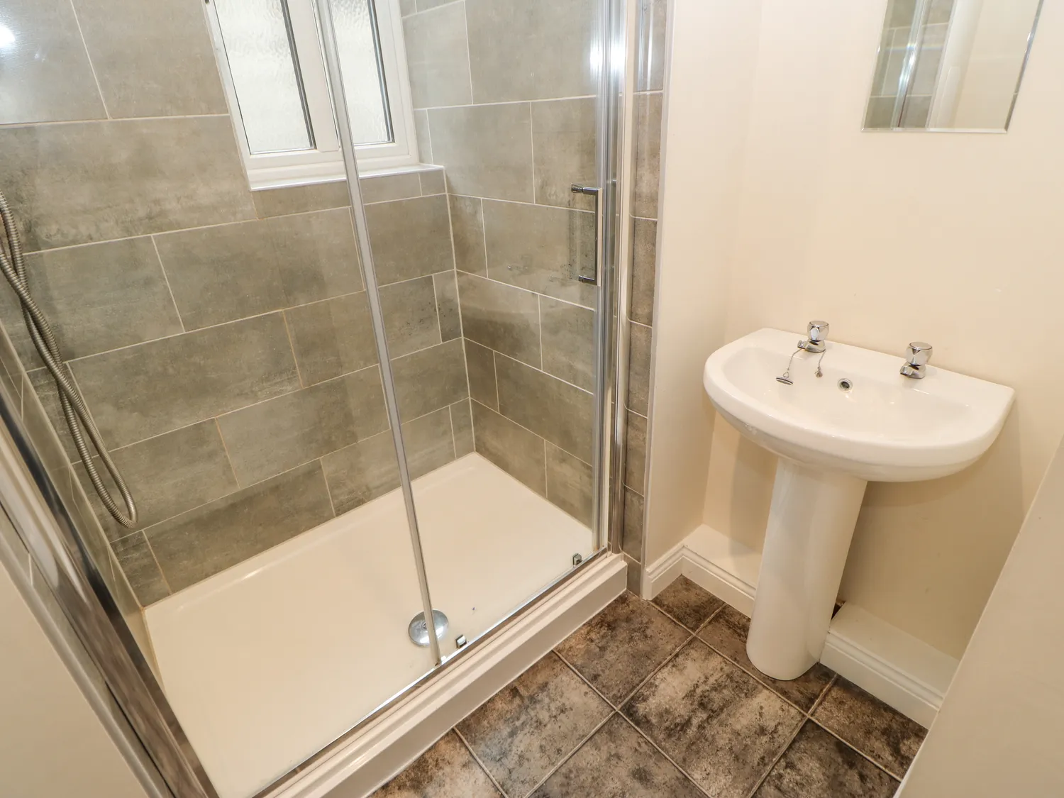 En-suite shower room with tiled shower at Heather Brae