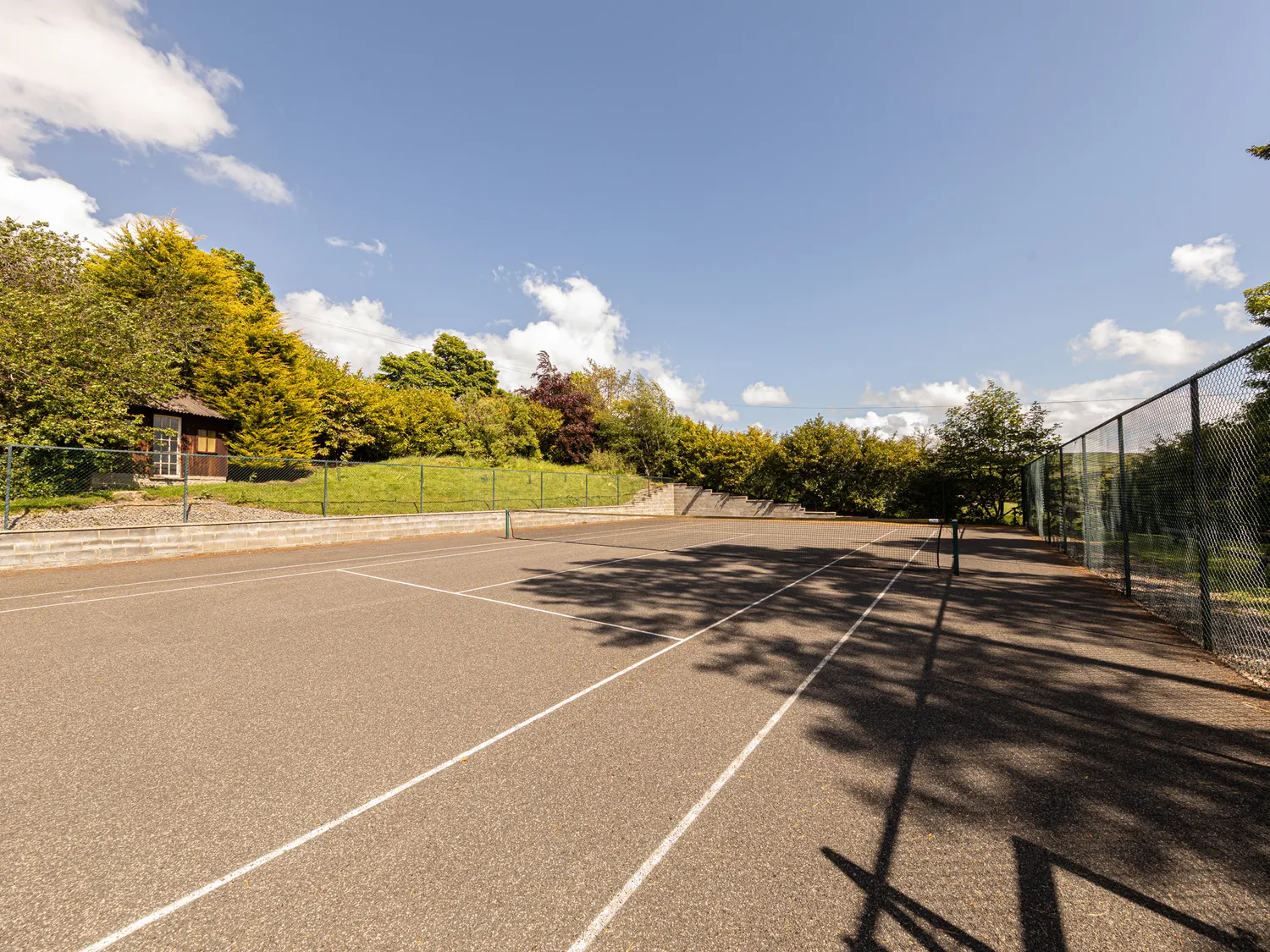 Full view of the tennis court at Heather Brae